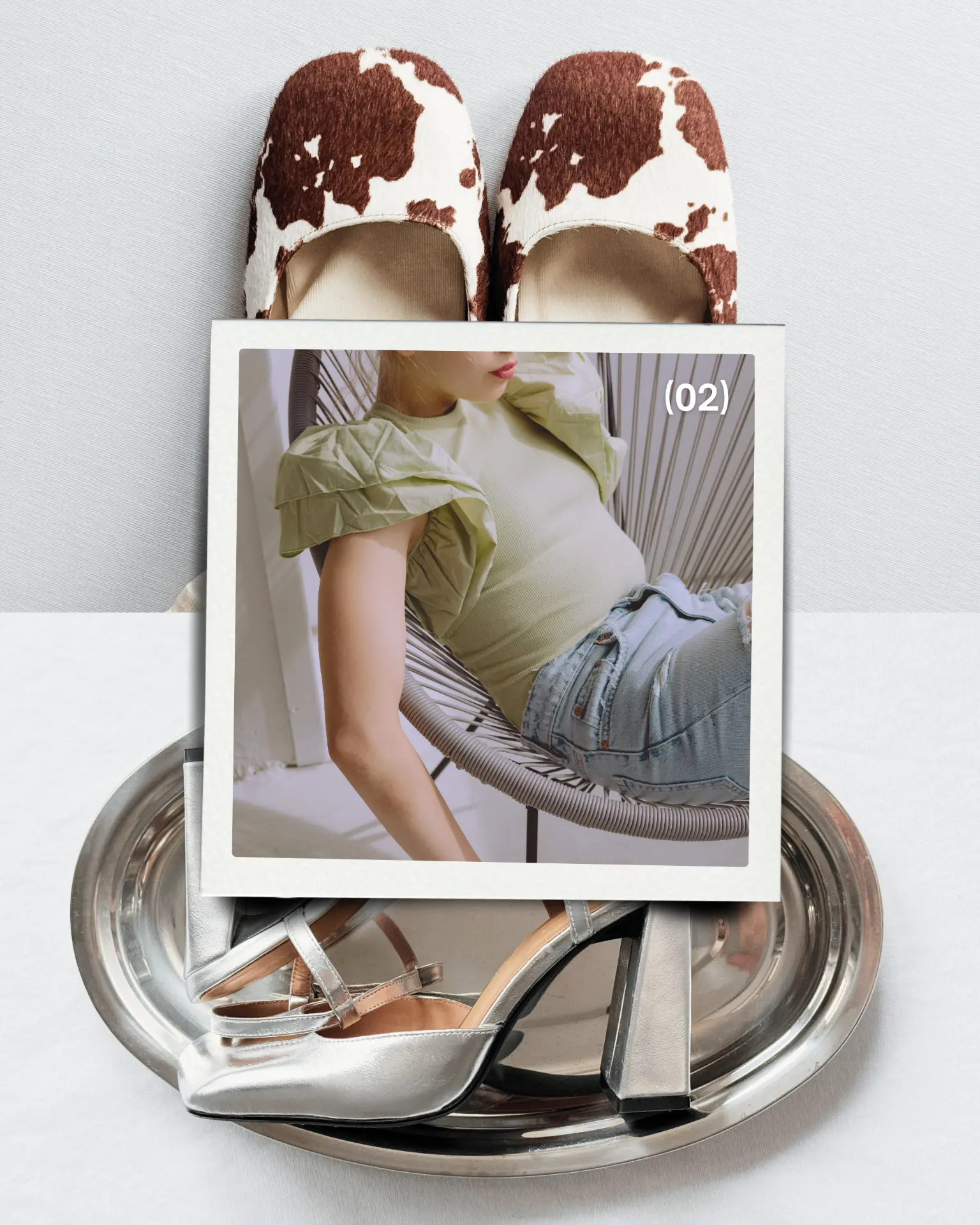 Silver pieces and shoes arranged on a metal tray