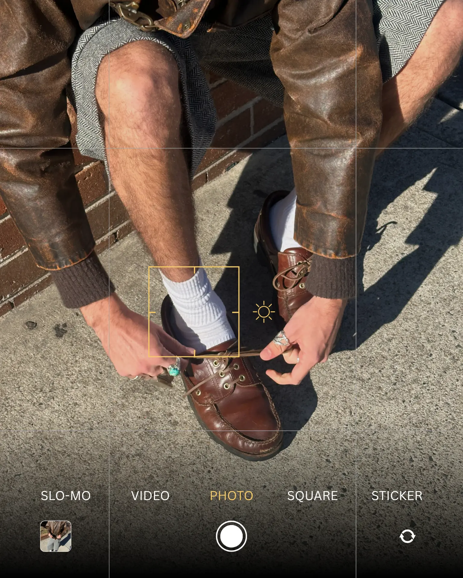 Tying leather shoes, shot on a phone