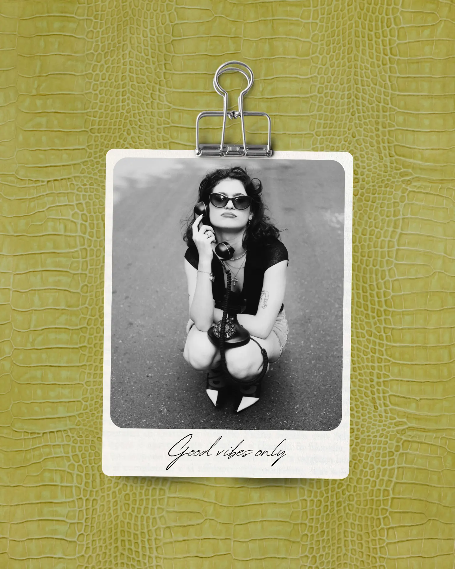 Hair styling detail — polaroid with sunglasses and telephone